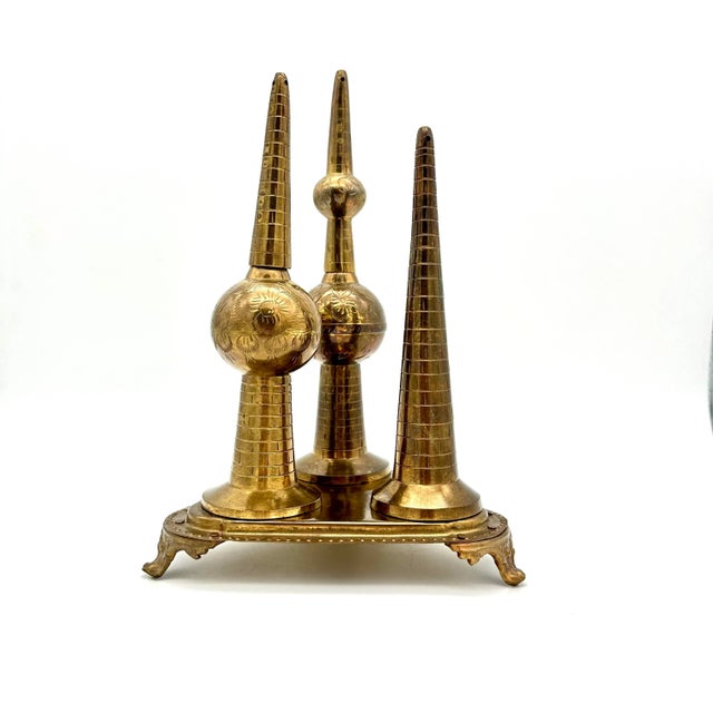 This vintage brass decorative item showcases the iconic Kuwait Towers in stunning detail. The towers are surrounded by...