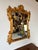 Elevate your space with this exquisite Hollywood Regency-style carved wood wall mirror, featuring an opulent gold finish....