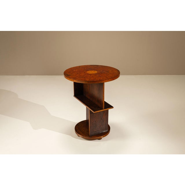 Some objects quietly demonstrate how geometry and craftsmanship can create lasting appeal. This Amsterdam School side...