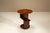 Some objects quietly demonstrate how geometry and craftsmanship can create lasting appeal. This Amsterdam School side...