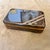 Capturing the opulent essence of 1970s high-society design, this exquisite decorative box is a masterclass in Mid-Century...