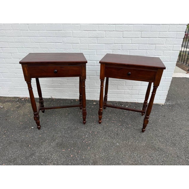Pair of Vintage Sheraton Style 1 Drawer Side Tables by Bombay Co. Featuring 1 drawer, H Stretcher base, turned legs Made...
