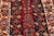 A decorative early 20th century Persian Shiraz antique carpet with five columns in red, ivory and black containing floral...
