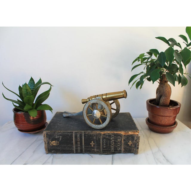 Vintage decorative brass and metal cannon. No makers mark. Minor age wear.