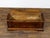 An Italian walnut coffer from the 18th century with lift top, geometric marquetry décor and bracket feet. This exquisite...