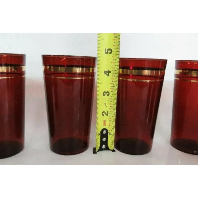 Mid 20th Century Ruby Red Glass Set of 7 Tumbler Water Juice Cups With Gold Trimb For Sale - Image 5 of 11