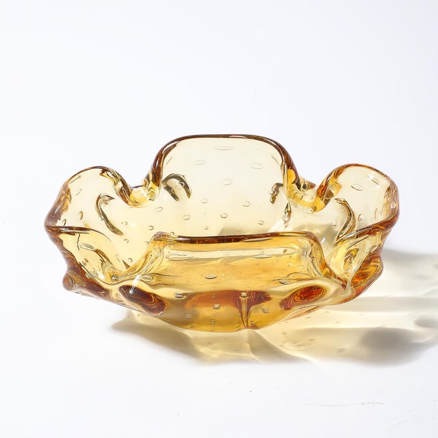 This Mid-Century Modernist hand-blown Murano glass dish showcases the exceptional craftsmanship for which Murano...