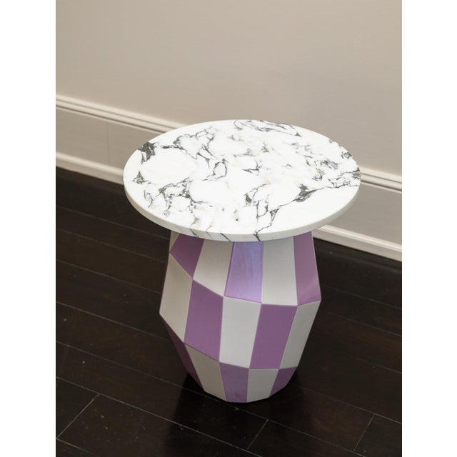 The "Joker" Ceramic Side Table by India Mahdavi is a vibrant, sculptural piece that brings joy and color to any space....