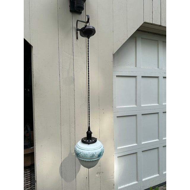 Old Lights On is pleased to offer this dark brass hanging fixture with vintage hanging glass blue and white globe. It is...