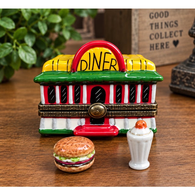 Charming vintage porcelain hinged trinket box designed as a classic American diner or drive-in restaurant. This whimsical...