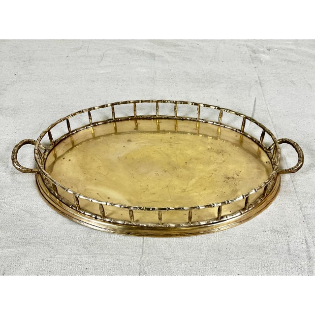 Vintage faux bamboo brass oval trap. Oval tray with faux bamboo railing trim and handles. Label reads "Decorative Crafts,...