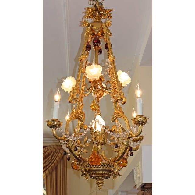 French Belle Epoque Style Gilt Bronze Crystal Chandelier Circa 1910 Dimensions : 47" Tall X 27" Round This stunning French...