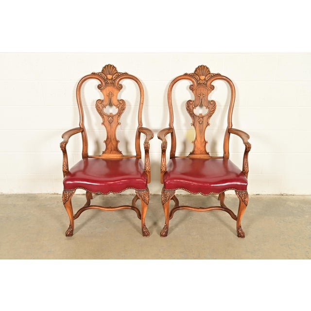 An outstanding pair of antique Georgian, Chippendale, or Queen Anne style armchairs or dining captain chairs By Berkey &...