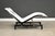 A modern chaise lounge constructed of steel and white saddle leather with several adjustments. Designed by Chi Wing Lo....