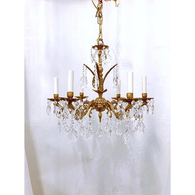 This is a decorative Spanish brass chandelier with 30% leaded Swedish cut drop crystal and octagon chain. The chandelier...