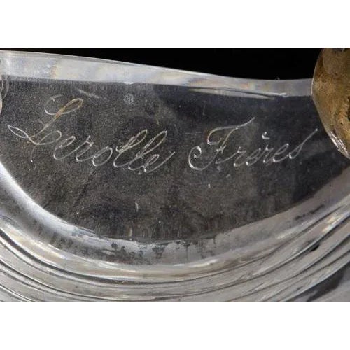 LEROLLE brothers. A magically beautiful chandelier made of chiseled and gilded bronze. The pear-shaped stands of which are...