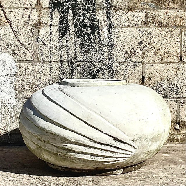 A gorgeous vintage white painted, deco style cement planter with ridges that can make your garden chic. Acquired at a Palm...