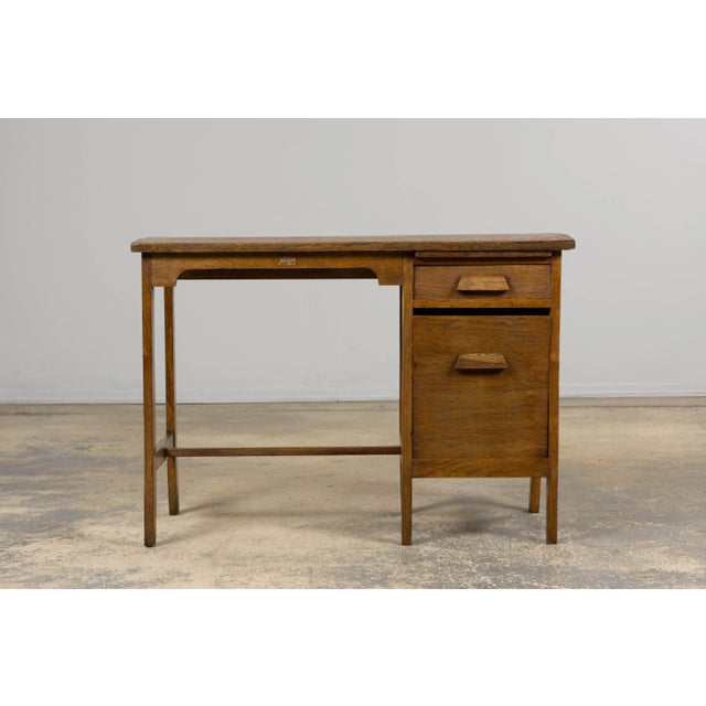 Petite French oak office desk, circa 1930s–40s. Carefully restored for structural integrity while retaining its authentic...