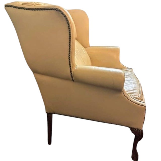 Experience timeless elegance with this premium leather wingback chair and matching ottoman set by Classic Leather. Crafted...