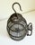A sculptural birdcage with beautiful patina, antique circa early 1900s, France. Made of blackened iron with a warm, aged...