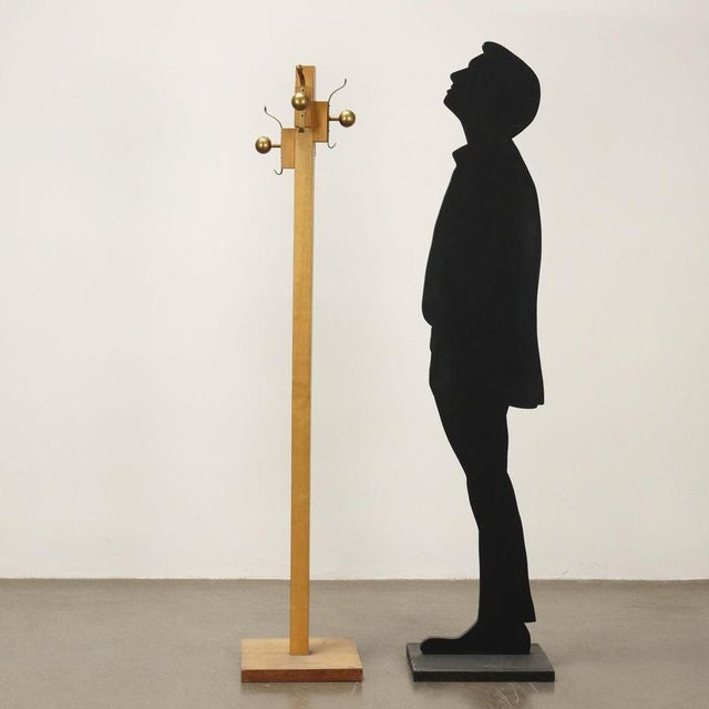 Coat hanger, in beech wood and brass. This piece is attributed to the mentioned designer/maker. It has no attribution mark...
