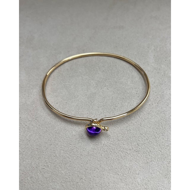 Created in 18kyg Amethyst 2 carats approx. Diamond 0.05 carat approx. Openable oval bracelet Hidden mechanism to open...