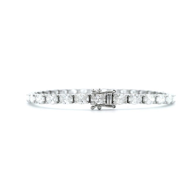 Stunning modern straight natural oval cut diamond tennis bracelet. Each stone GIA certified D-F color and VVS1-VS1...