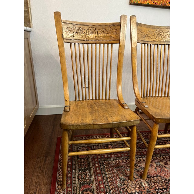 These chairs feature an an ornate "pressed" crest, slender spindles and beautifully shaped legs to give it a distinctive...