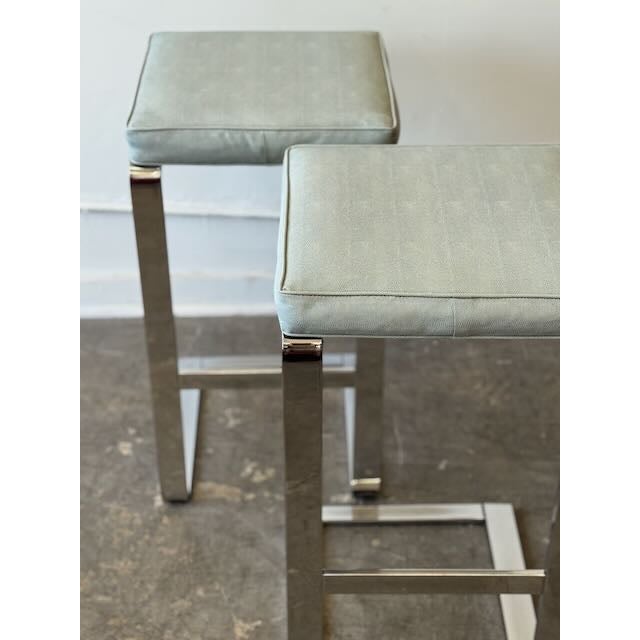 Just in, we have a pair of Milo Baughman style barstools. Chrome plated steel cantilever frame with blue-gray faux reptile...