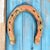 Curated set of 3 rustic iron decor. An antique pony horseshoe by Diamond and a matching pair of Vjntage Diamond Pitching...