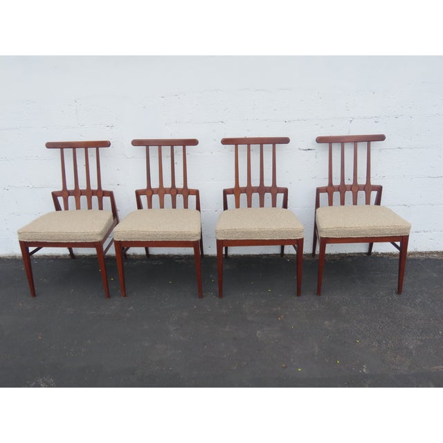This high quality Set Four Chairs is made out of wood, solid wood, veneer, and upholstery. The chairs were made by Foster...