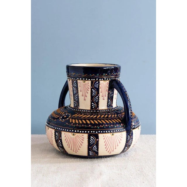This midcentury French faience vase from Quimper features a bold baluster shape, with a wide body, narrow neck, and two...