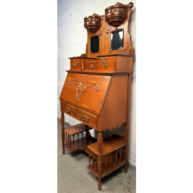 Elevate your interior with the timeless elegance of this Victorian antique slant front secretary desk, crafted in richly...