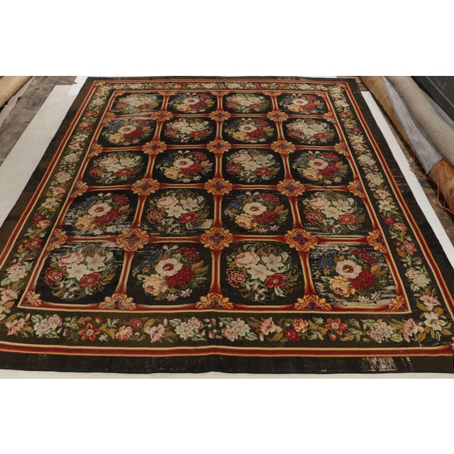 A 13x15 English needlepoint rug from the 1920s joining Rug & Kilim’s Antique & Vintage collection. The rich piece...