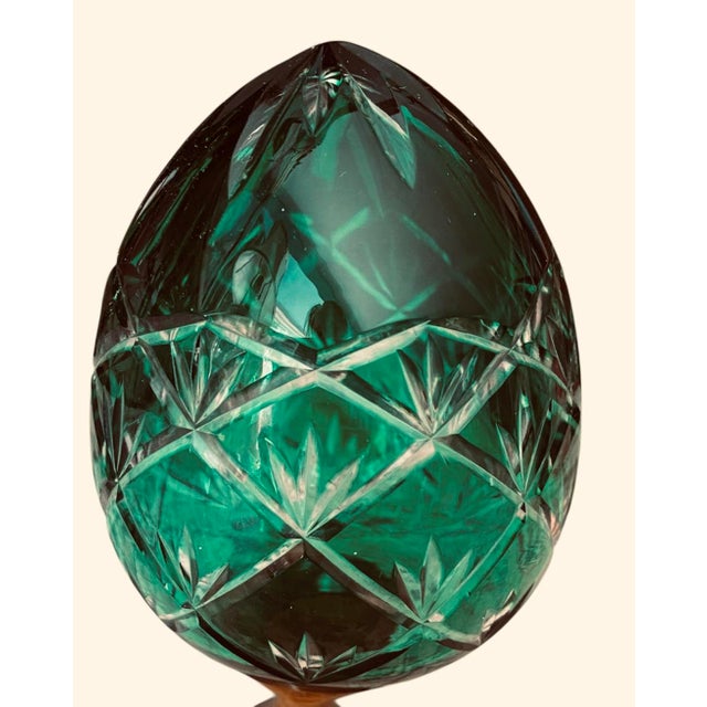 Emerald green cut-glass crystal egg. Dimensions are 3.5" tall by 3" wide. Flat bottom. Excellent condition.