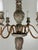 A beautifully timeworn six-light chandelier of European origin, dating to the 19th century, crafted in carved wood with an...