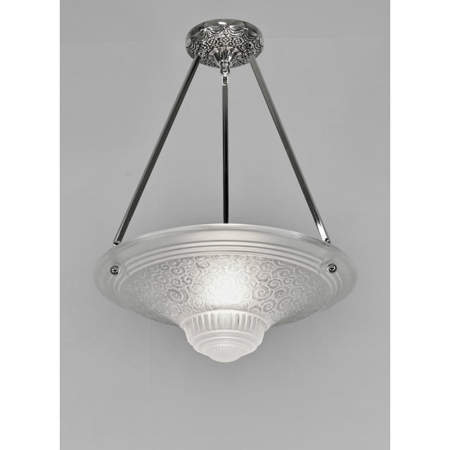 Muller frères A nickel plated bronze or solid brass French art deco pendant light made around 1930. It holds a nice bowl...