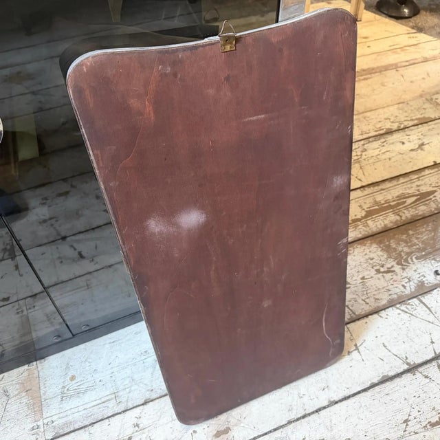 This exquisite 1950s wall mirror in the style of legendary architect and designer Gio Ponti boasts a captivating "biscuit"...