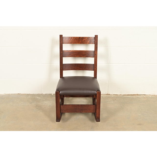 An exceptional antique Mission or Arts & Crafts period ladder back rocking chair By Gustav Stickley (signed with red...