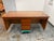 Design Plus Gallery presents a Mid-Century Modern Style Walnut Executive Desk. The desk has a broad rectangular walnut...