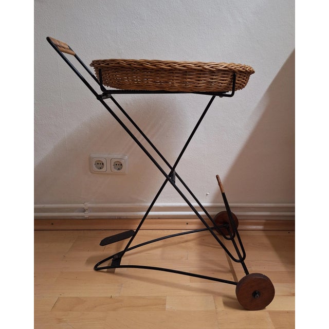 Vintage Tea Trolley with Newspaper Shelf in Black Iron Frame, Teak Wheels and Removable Wicker Tray, 1970s For Sale - Image 9 of 9