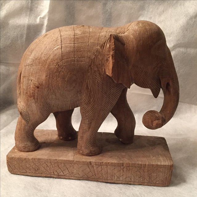 Circa the 1850s, this hand-carved elephant statue derives from Thailand. It is crafted of solid teak wood and features a...