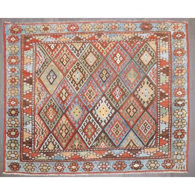 a highly decorative early 20th-century Colorful Jaff Kurd rug Details rug no. j3697 size 2' 11" x 3' 8" (89 x 112 cm)