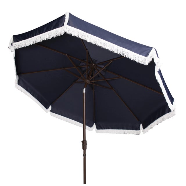 Summer afternoons at an exclusive private members club inspired this posh nine-foot crank umbrella. it's classic navy...