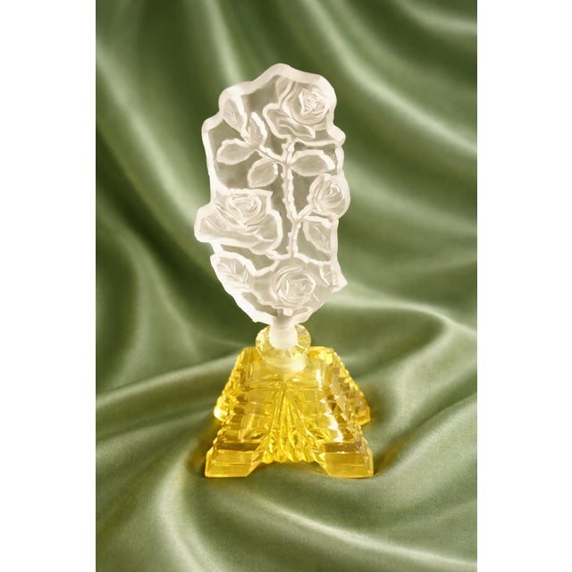 Vintage Bohemian Czechoslovakian perfume bottle. The oversized Intaglio stopper compliments the faceted crystal base....
