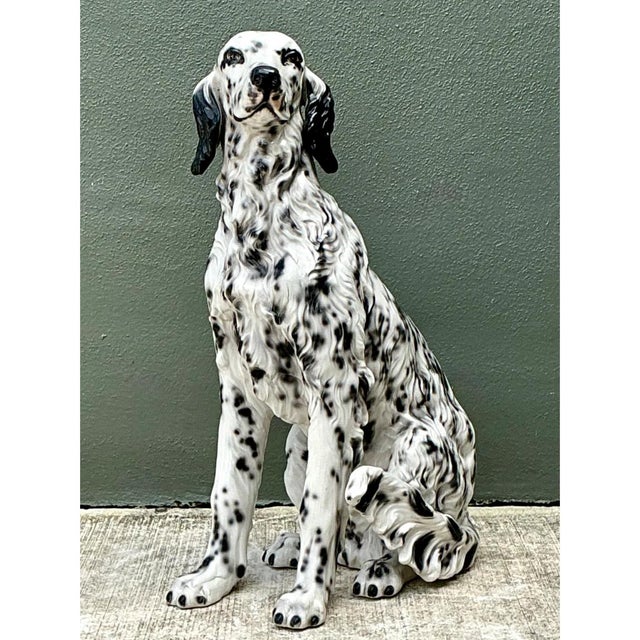 This vintage Italian ceramic dog statue captures an English Setter seated in an alert, dignified pose, its head tilted...
