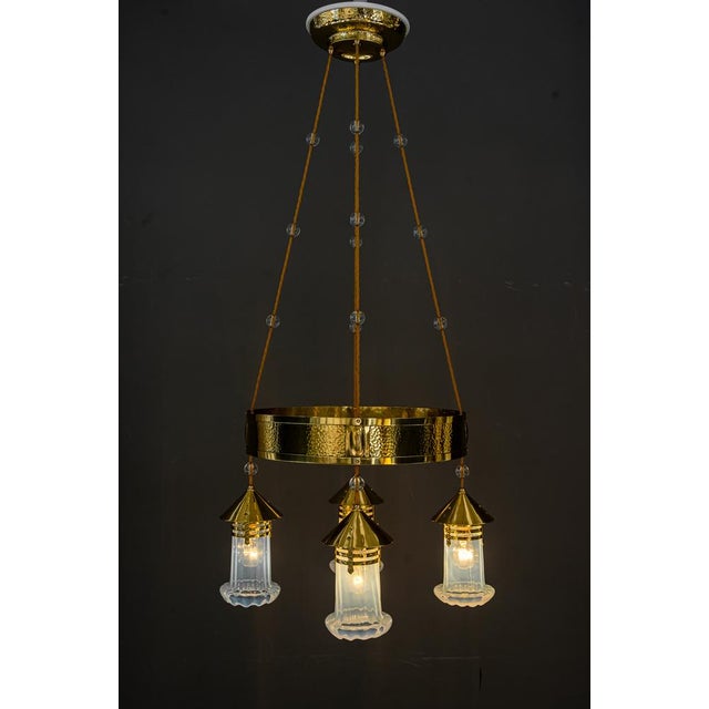 Hammered Art Deco Chandelier with opaline glass shades, Vienna, around 1920. Polished and stove enameled. Original old...