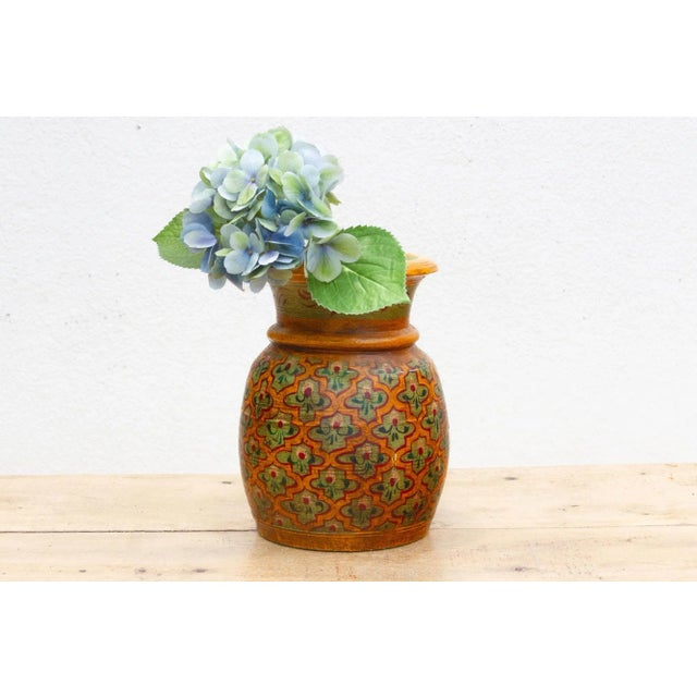 This charming old wooden decorative pot, measuring 8 inches in diameter and 10 inches high, is a delightful testament to...