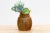 This charming old wooden decorative pot, measuring 8 inches in diameter and 10 inches high, is a delightful testament to...