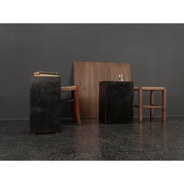 This striking set of two cubic coffee tables combines the clean lines of Mid Century Modern design with the raw,...